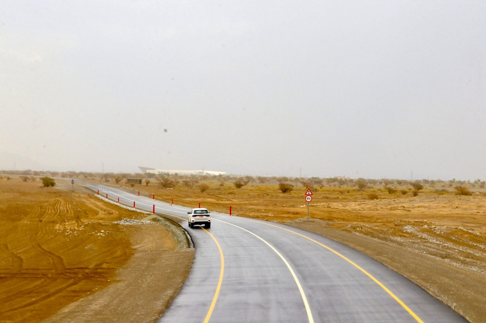 A vehicle travelling on the newly opened link road, with a speed limit sign at the roadside